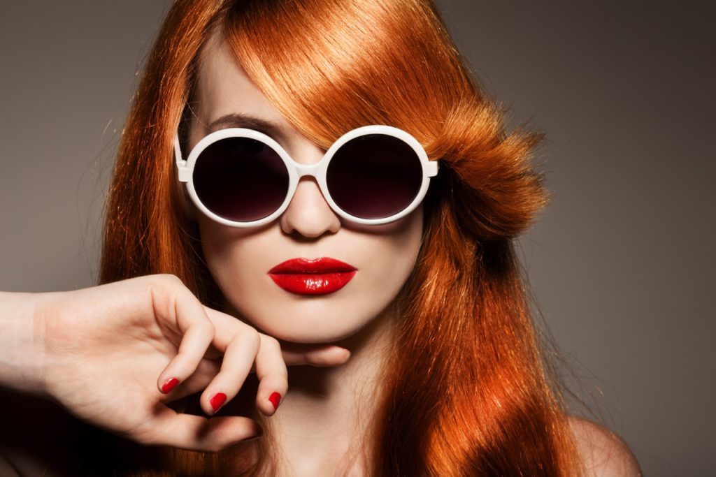 Beautiful woman with bright make-up and sunglasses